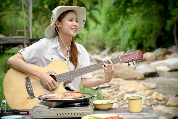 Relaxed Peaceful Young Asian Female Camper Traveler Sitting River Singing — Stockfoto