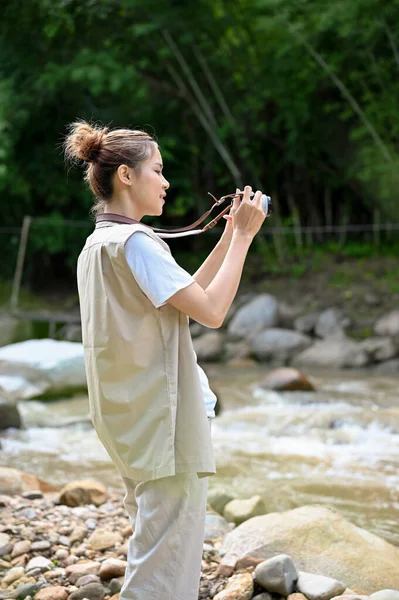 Attractive Young Asian Female Taking Picture Beautiful Forest River Her — Stockfoto