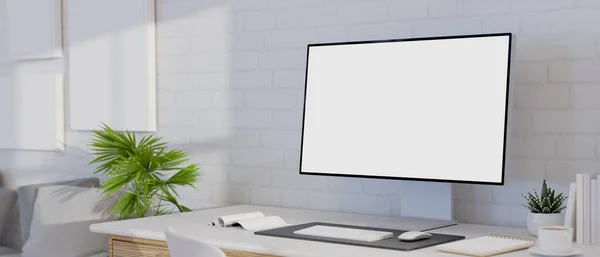 Minimal white workplace interior design with blank PC desktop computer mockup, stationery and decors on white table over white brick wall. 3d rendering, 3d illustration