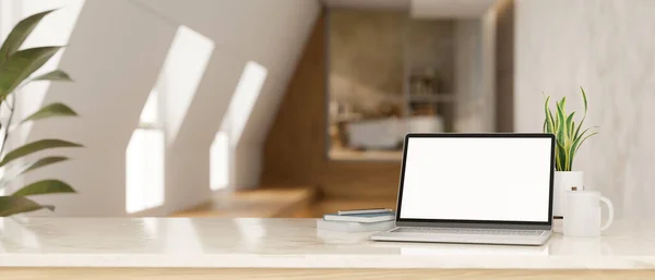 Tabletop with notebook laptop white screen mockup, coffee cup, book, decor plant and copy space for product display over blurred minimal home corridor in the background. 3d rendering, 3d illustration