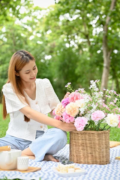 Attractive Young Asian Female Picnicking Garden Holding Flower Basket Sitting — Fotografia de Stock