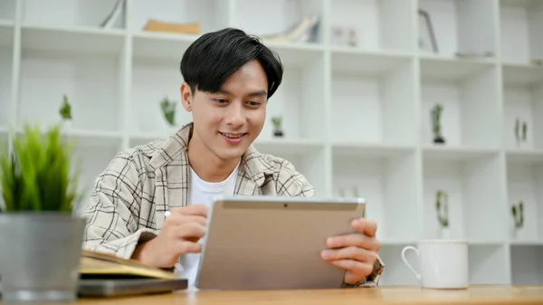 Handsome Young Asian Man Causal Outfit Using Digital Tablet Touchpad — Stockfoto