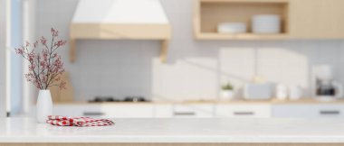 Modern luxury white kitchen tabletop with decors and copy space for montage your product display over blurred modern kitchen space in the background. 3d rendering, 3d illustration