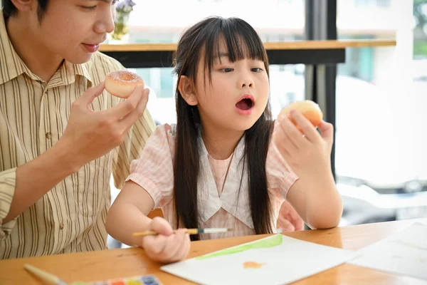 Cute Young Asian Girl Holding Doughnut Enjoying Eating Doughnut Coffee — Stockfoto