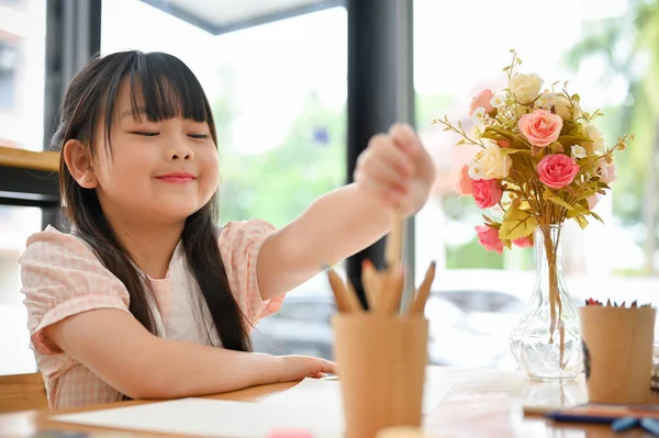 Cute Charming Asian Young Girl Doing Homework Enjoys Drawing Paper — Stockfoto