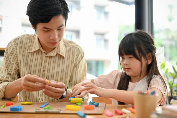 Pretty Young Asian Girl Concentrating Sculpting Play Dough Making Colorful — Stockfoto