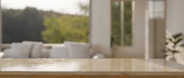 Arkaplanda bulanık, rahat oturma odasının üzerinde ürününüzün görüntüsünü görüntülemek için boş bir maket alanı. 3d görüntüleme, 3d illüstrasyon