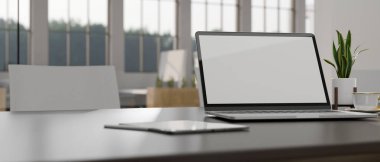 Yakın plan, modern bir çalışma alanında çalışma alanı dizüstü bilgisayarın beyaz ekran modeli, tablet, dekor bitkisi ve kahve fincanı masanın üzerinde. 3d görüntüleme, 3d illüstrasyon