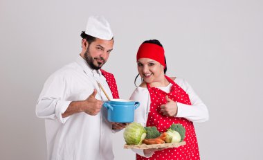 Italian Chiefcook in Red Apron and Handsome Cooky are Showing Nu clipart