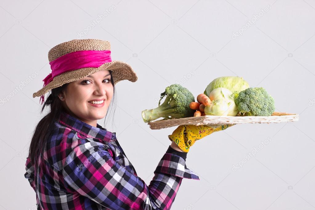 Happy Garden Woman with Tray of Vegetables