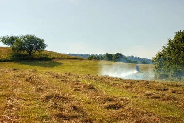 Motorbike Rider en Morning Meadow —  Fotos de Stock