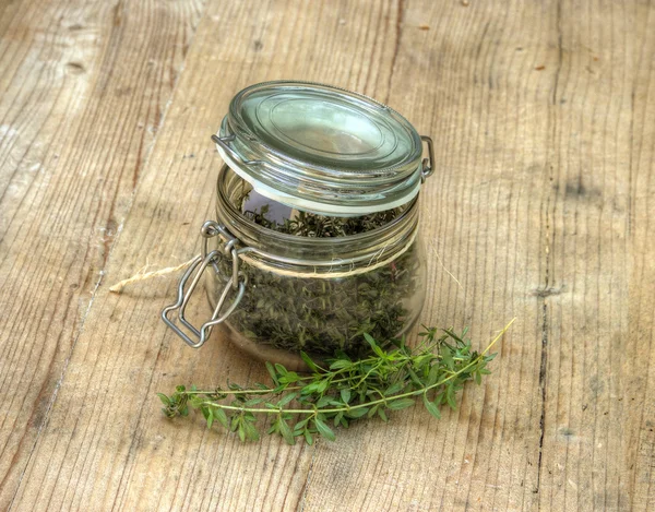 Dry Herbs in Glass Bottle — Stock Photo, Image