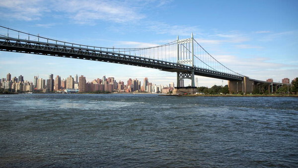 Triborough Bridge, view from Astoria Park in Queens, northern Manhattan skyline in the background, New York, NY, USA - October 3, 2021