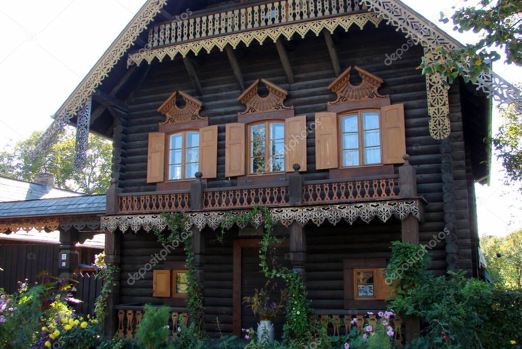 Traditional wooden log house of the Russian village Alexandrowka, built around 1826 for a singers of the Russian choir of Prussian King Frederick William III, Potsdam, Germany - September 23, 2007