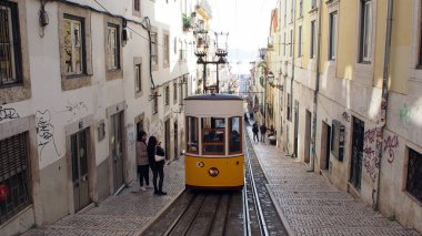 Tram car of the Bica Funicular, Ascensor da Bica, at the upper station, Lisbon, Portugal - December 15, 2021 clipart