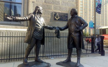 George Washington presents his Masonic Apron, gift from General Lafayette, to Benjamin Franklin, sculpture at the Masonic Temple by the City Hall, Philadelphia, PA, USA - November 8, 2020