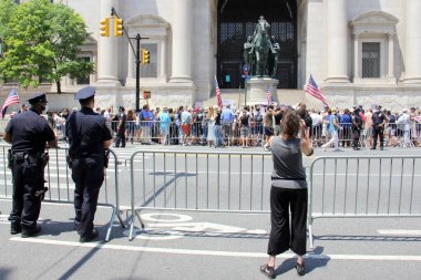 Protesters at the foot of the Theodore Roosevelt equestrian monument at the Museum of Natural History, NYPD officers and spectator in the forefront, New York, NY, USA - June 28, 2020