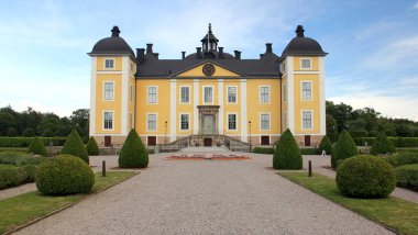 Stromsholm Castle, western facade, royal baroque palace on an island in the Kolbacksan river at the west end of Lake Malaren,  Sweden - July 7, 2019