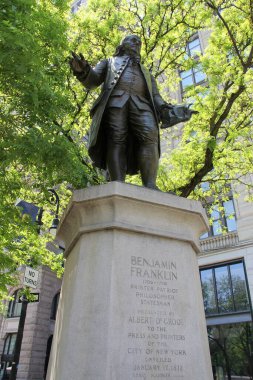 Statue of Benjamin Franklin, by Ernst Plassman, unveiled in 1872, in Lower Manhattan, at the intersection of Park Row and the Brooklyn Bridge approach, New York, NY, USA - May 21, 2022