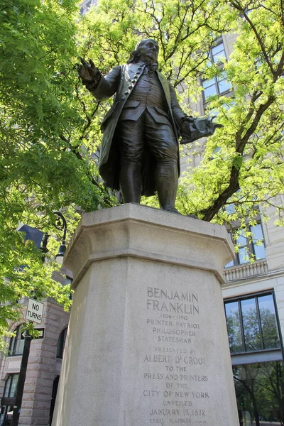 Statue of Benjamin Franklin, by Ernst Plassman, unveiled in 1872, in Lower Manhattan, at the intersection of Park Row and the Brooklyn Bridge approach, New York, NY, USA - May 21, 2022