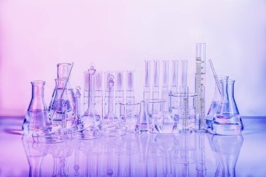 composition of varieties of laboratory glassware for scientific research and experiment chemistry pharmaceutical biotectnology biology cosmetic and education with reflection