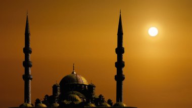 Kubbeli siluet İslami cami manzarası ve gündoğumunun arka planında iki kule.
