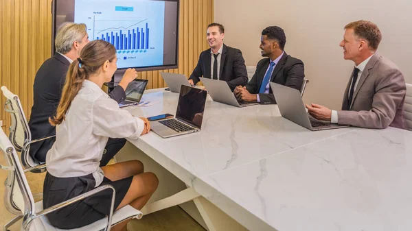 business background of diverse businessperson meeting and brainstorming together in meeting room with presentation monitor show business information selective focused
