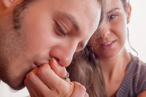 Man gently kisses hand of his girlfriend — Stock Photo, Image