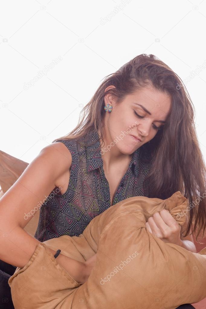 woman punching pillow