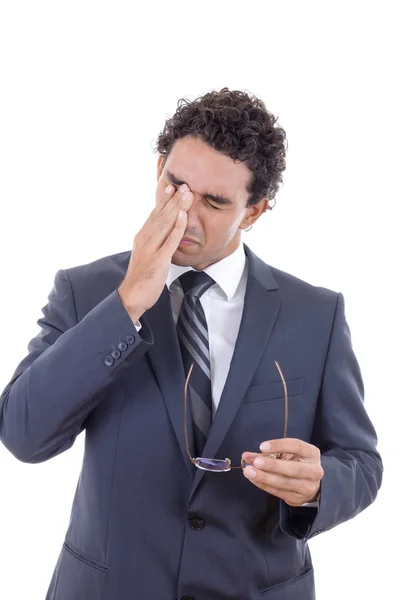 Man with a headache holding glasses — Stock Photo, Image