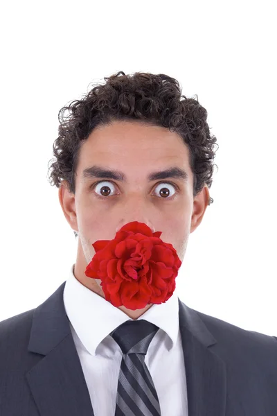 Uomo con una rosa in bocca — Foto Stock