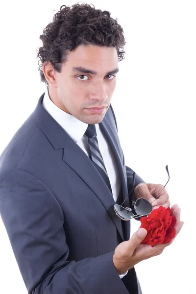 Seducer in suit holding rose — Stock Photo, Image