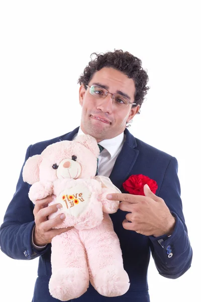 Nešikovný člověk drží teddy menu — Stock fotografie