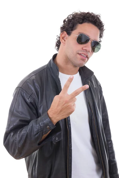 Man in a leather jacket with sunglasses showing peace — Stock Photo, Image