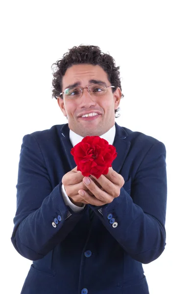 Nerd with expression holding flower — Stock Photo, Image