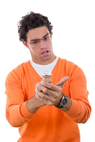 Confused man with glasses holding light bulb — Stock Photo, Image