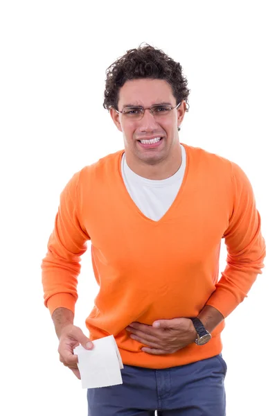 Hombre necesitado con problemas de estómago sosteniendo papel higiénico en naranja —  Fotos de Stock