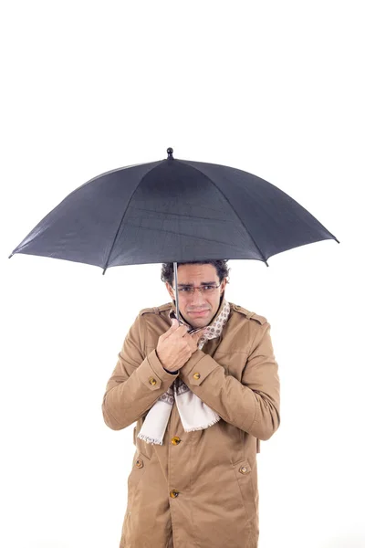 Man in the coat with umbrella freezes — Stock Photo, Image