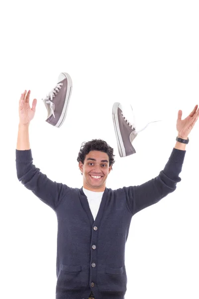 Man with sneakers throwing them away — Stock Photo, Image