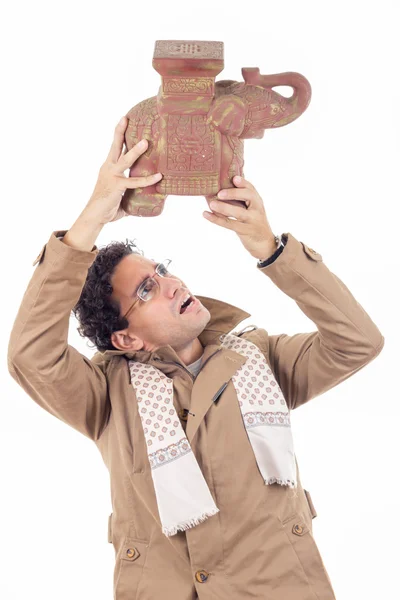 Man with the coat looking artifact — Stock Photo, Image