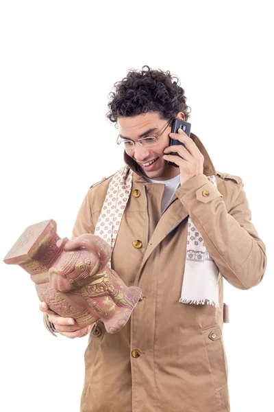 Smiling professor on the phone in coat with glasses looking art — Stock Photo, Image