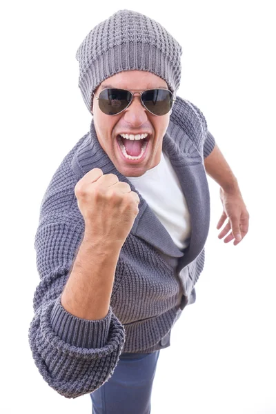 Successful man in sweater wearing winter cap and sunglasses — Stock Photo, Image