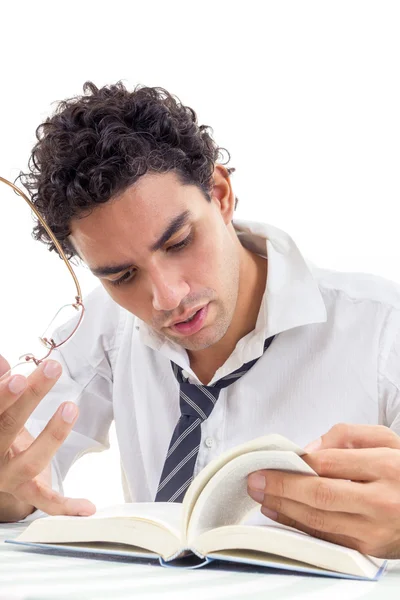 Man in the shirt with tie sitting and reads book — Stock Photo, Image