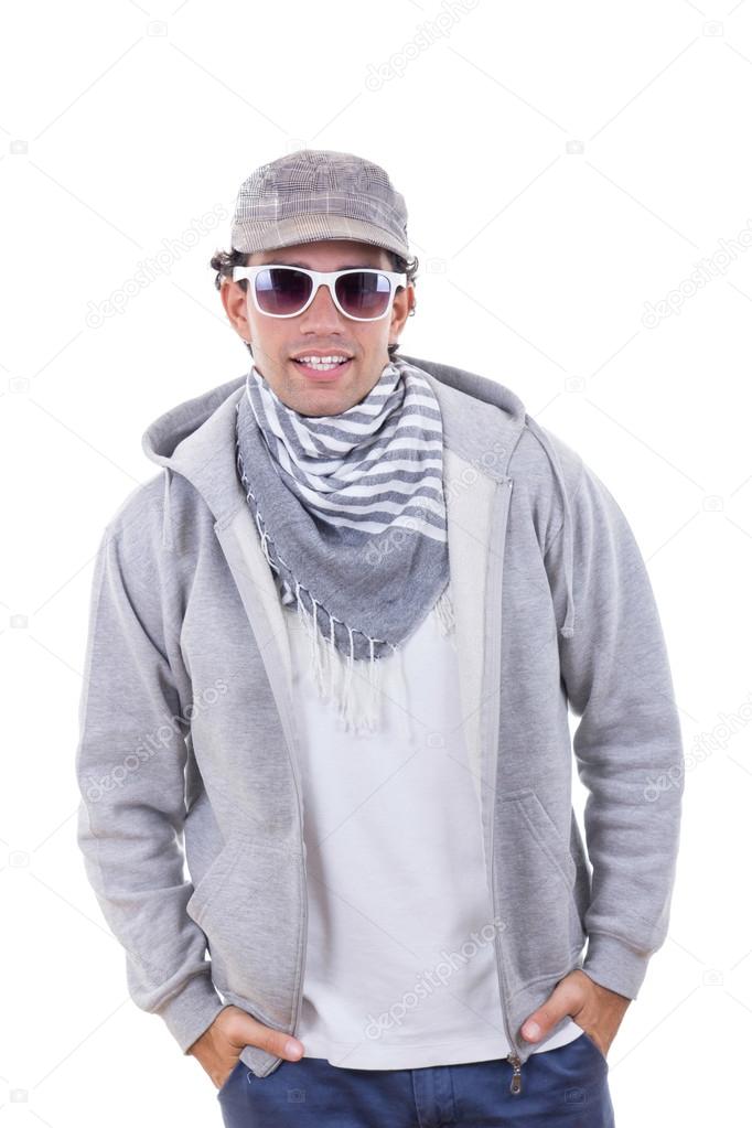 modern fashion man in sweatshirt wearing cap and scarf with sung