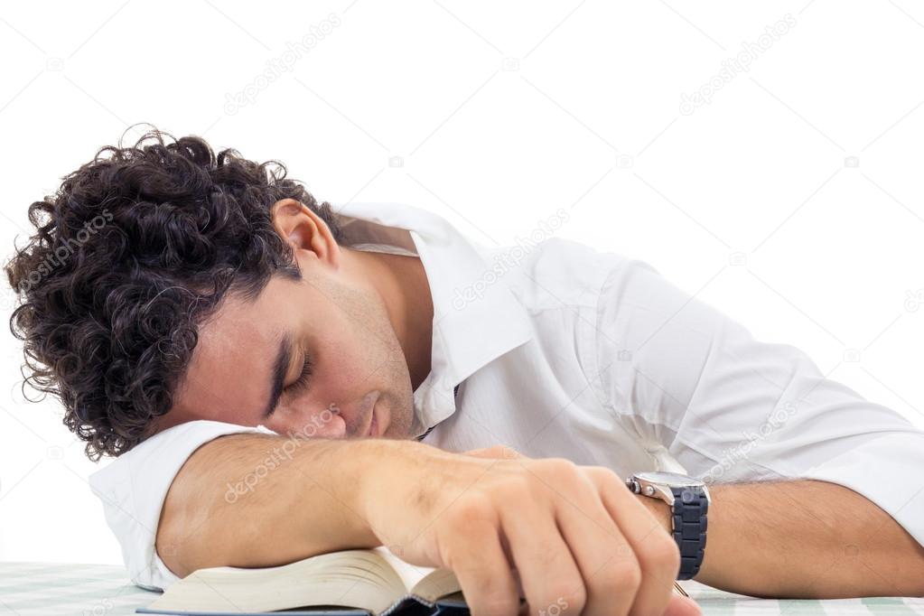 tired man with glasses in white shirt and tie sitting with book
