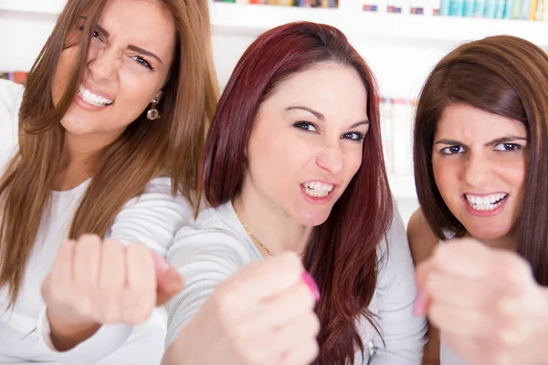 Women winners hold fists as sign of success and happiness — Stock Photo, Image