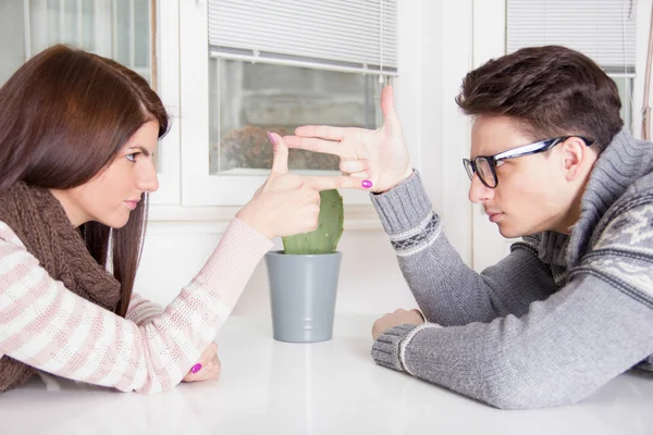Couple in confrontation pointing at each other with challenge at — Stock Photo, Image