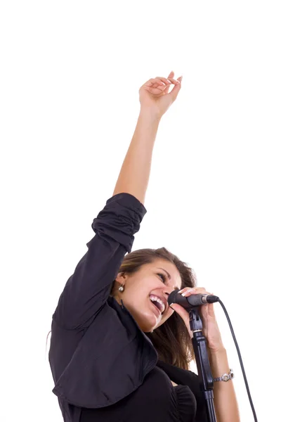 Attraktiv kvinna sjunga Mike med hennes hand upp — Stockfoto