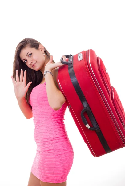 Bella giovane donna con valigia da viaggio dicendo goodbuy — Foto Stock