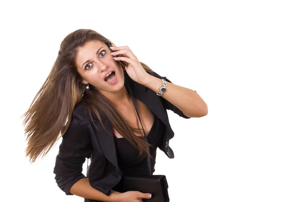 Shocked business woman talking on the phone — Stock Photo, Image